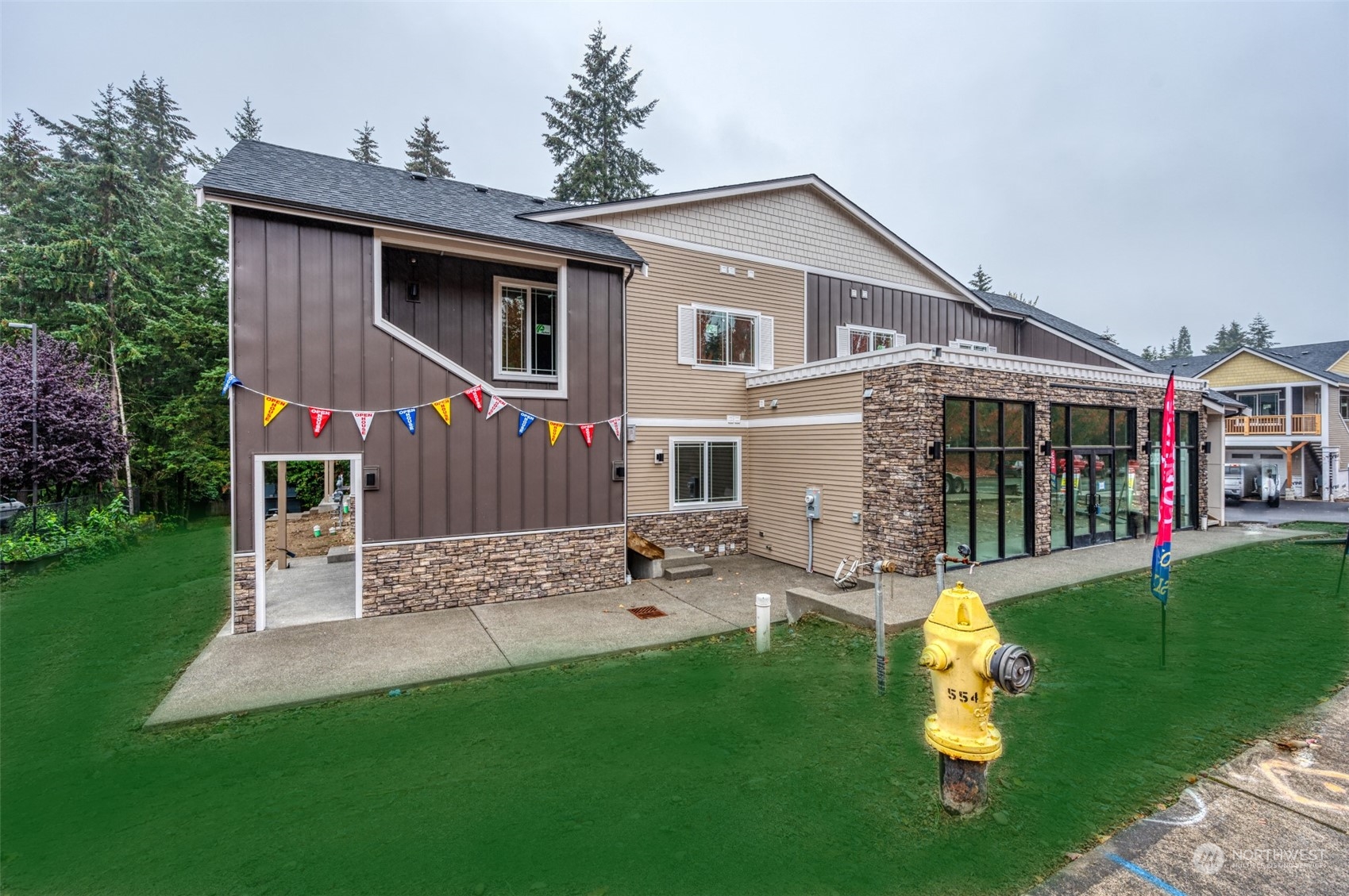 a front view of house with yard and green space