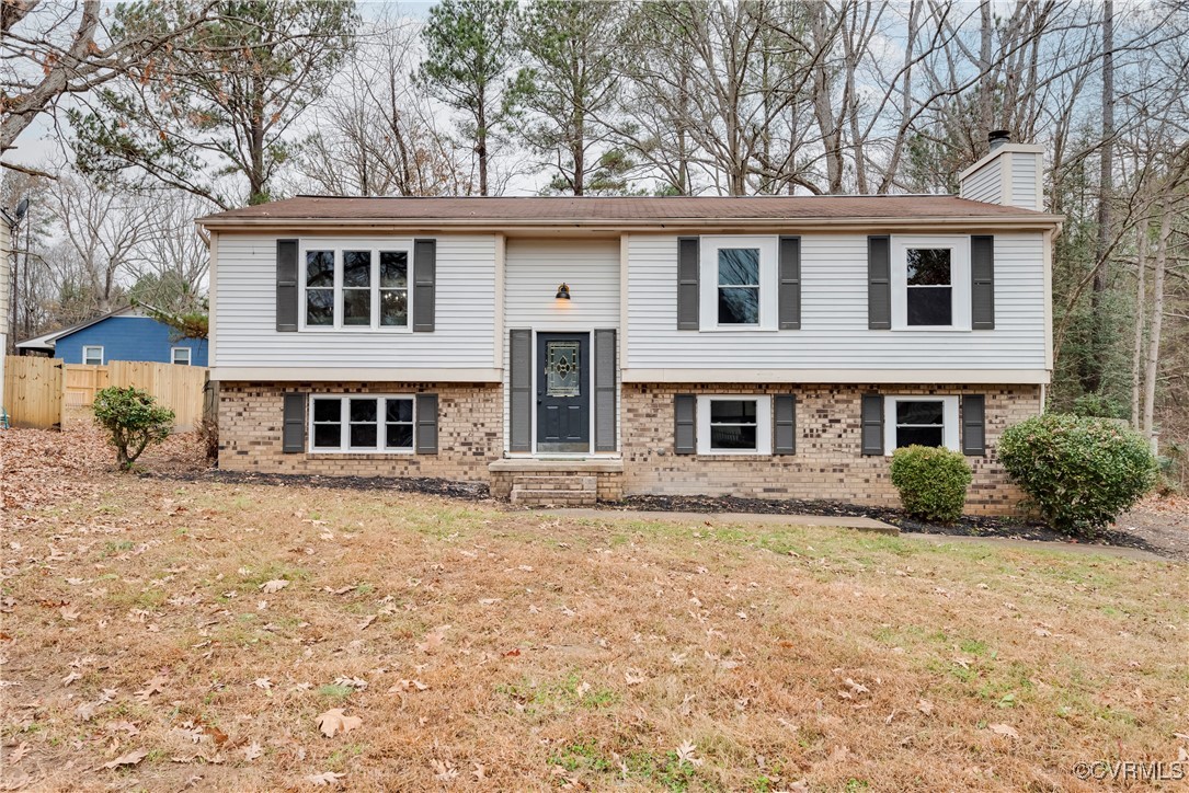 Bi-level home with a front yard