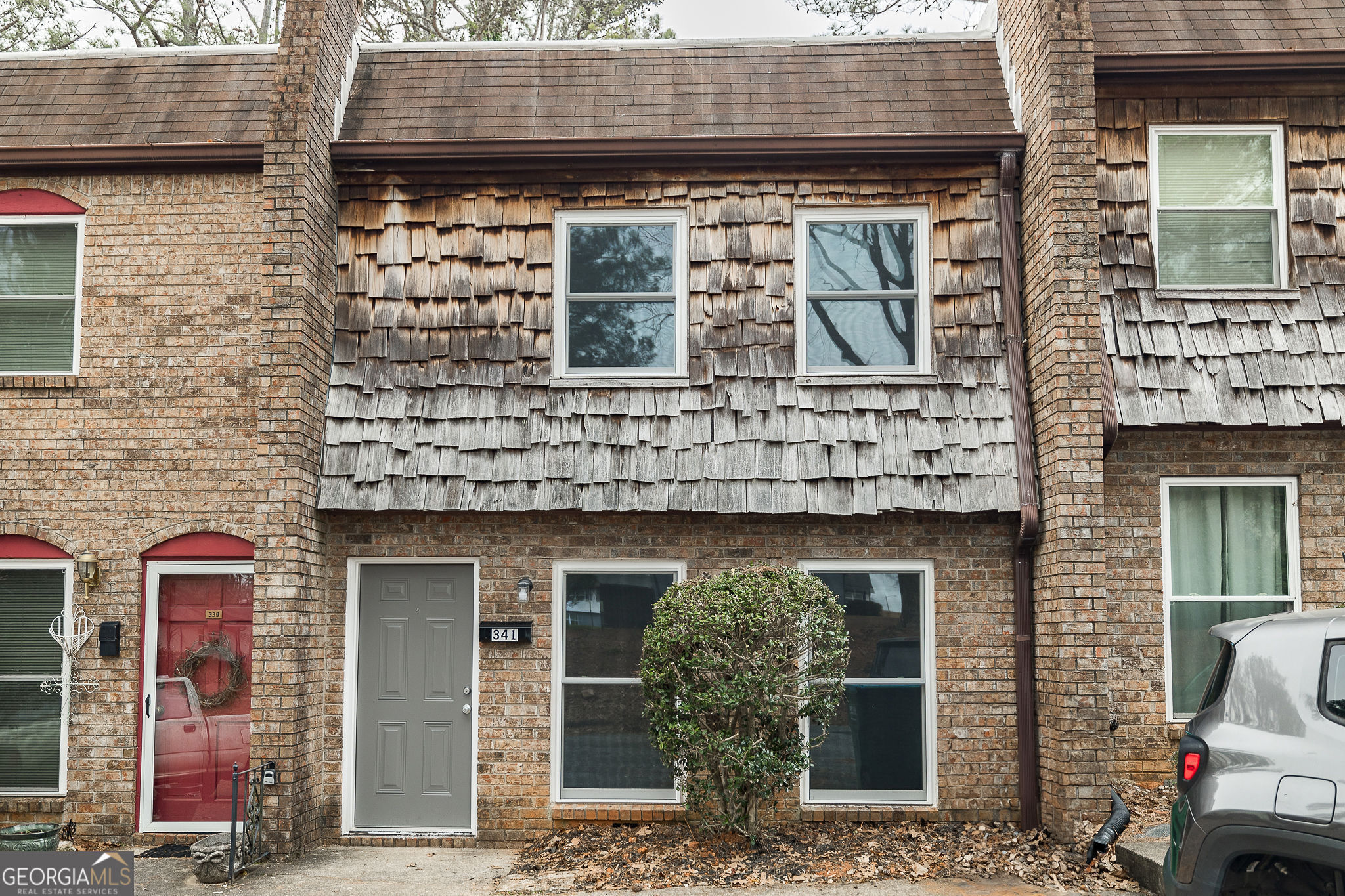 a front view of a house with glass windows