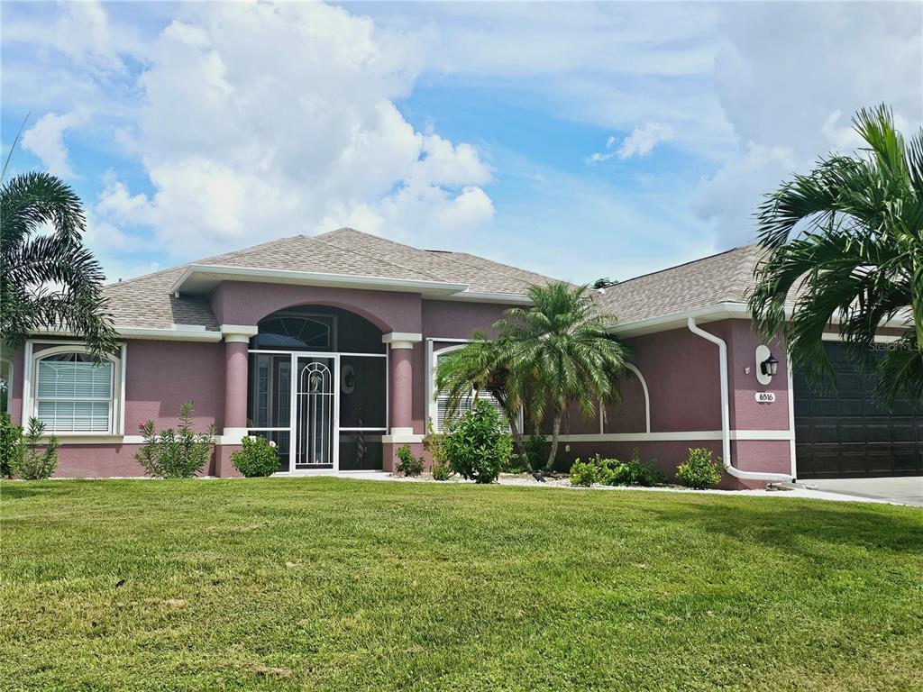 a front view of a house with a yard