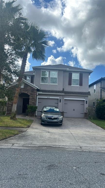 a view of a car parked in front of a house