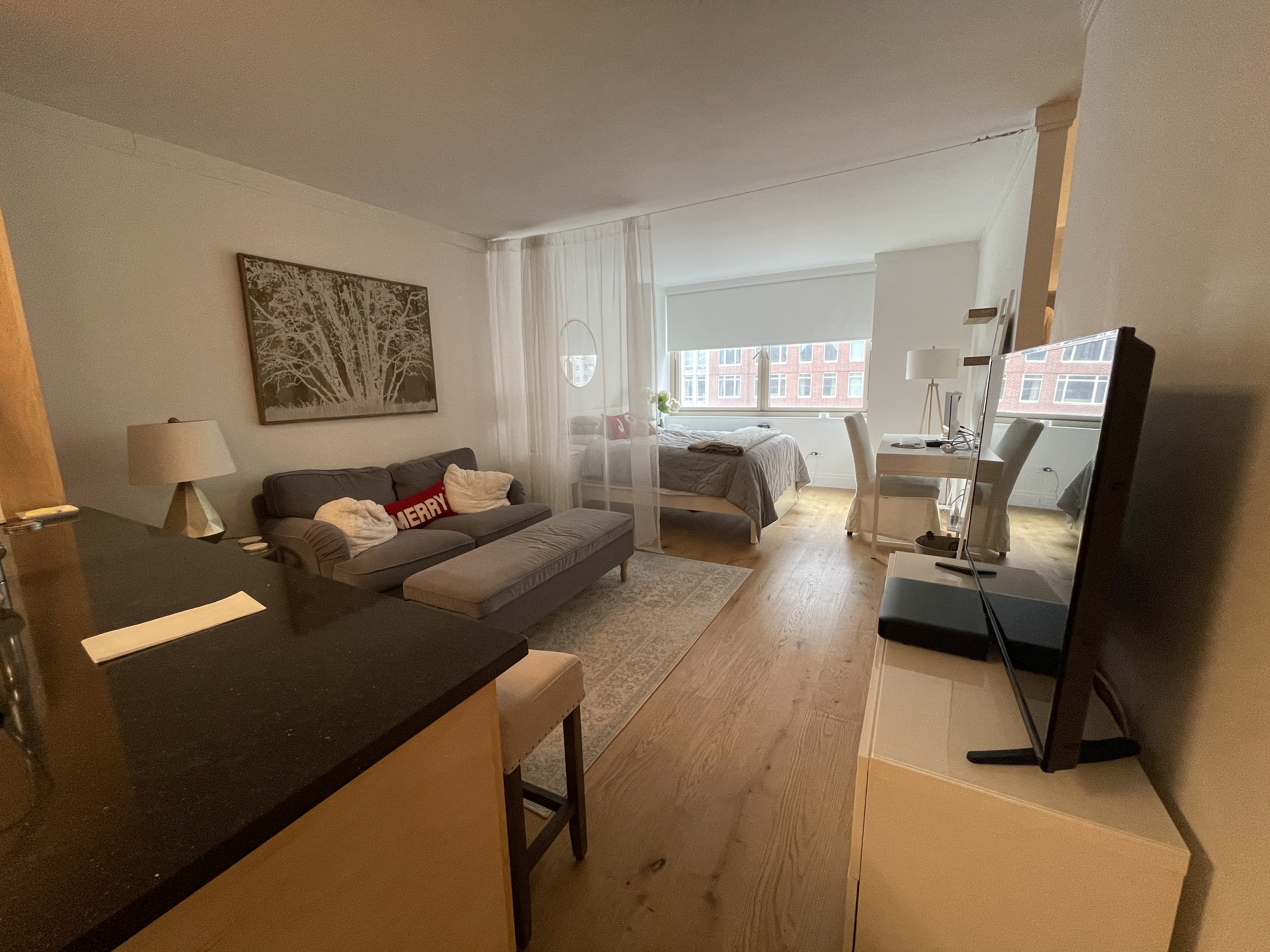 a living room with furniture and a window