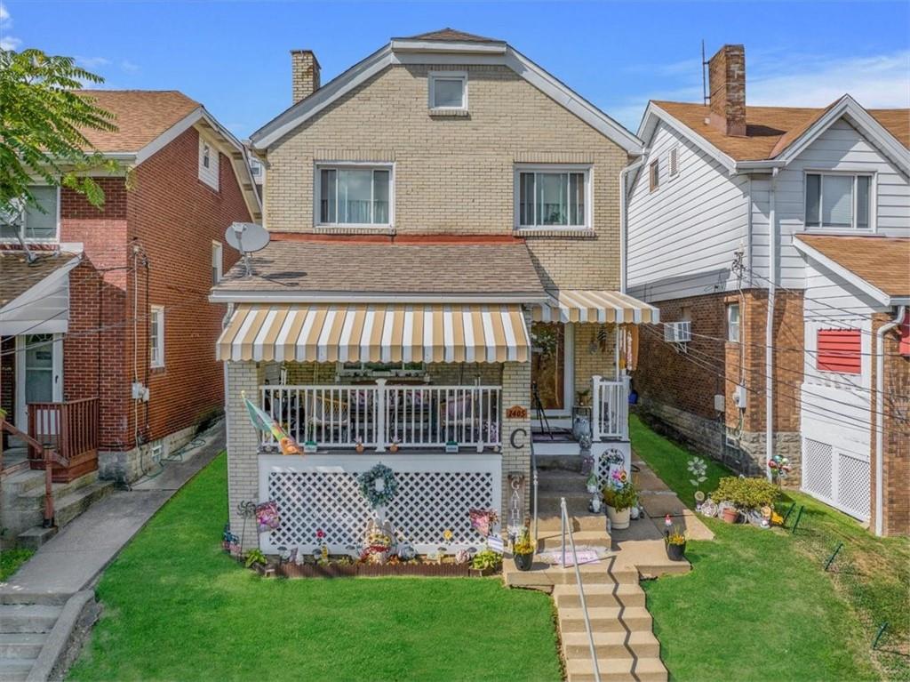 a front view of a house with garden