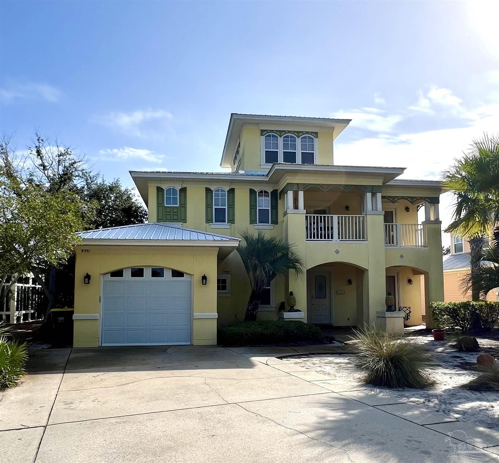 a front view of a house with parking