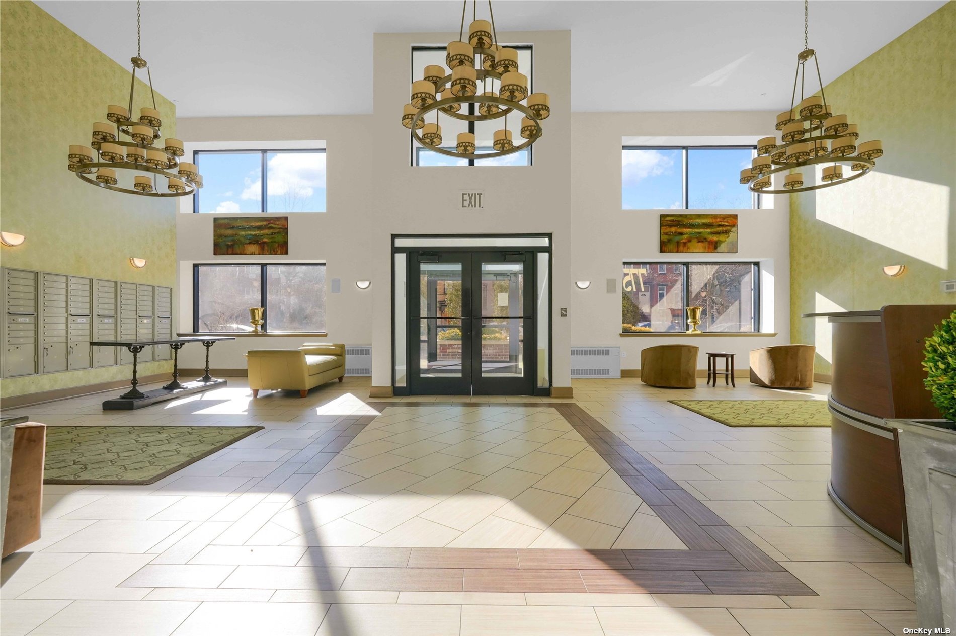 a living room with stainless steel appliances kitchen island granite countertop a sink and cabinets