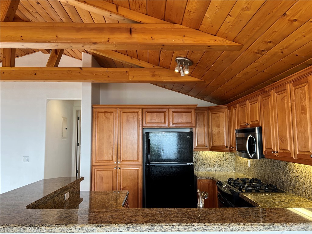 a kitchen with a refrigerator and a sink