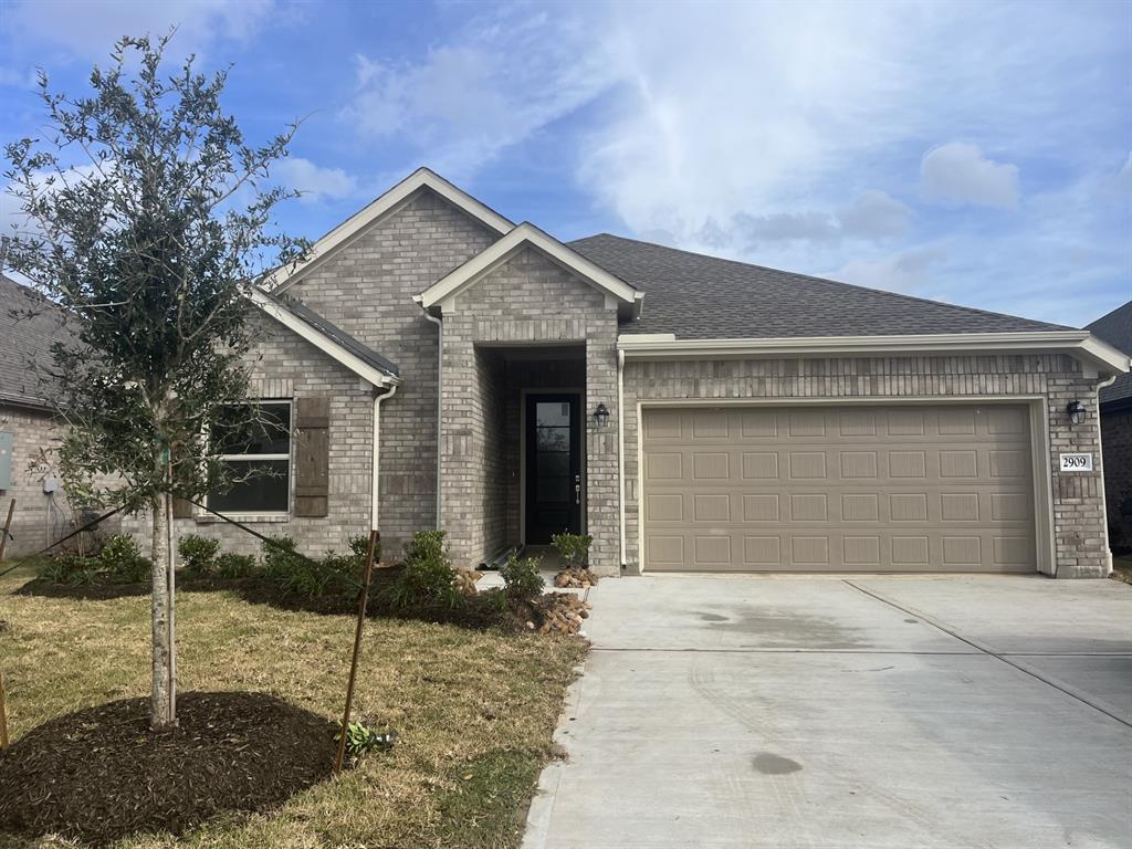 a front view of a house with a garage