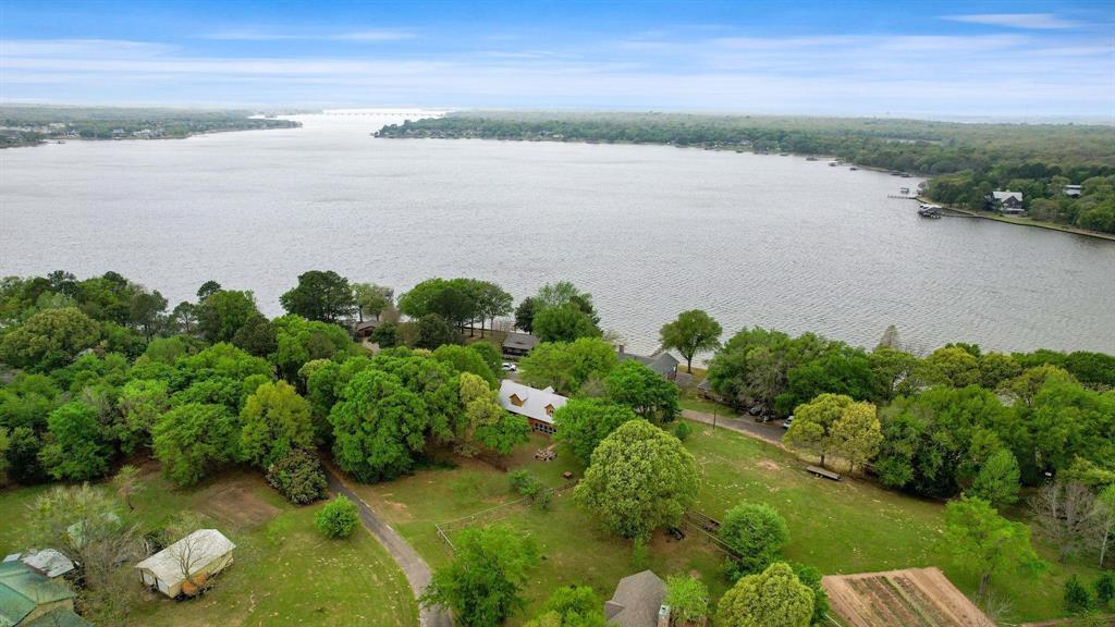 a view of a lake with a yard