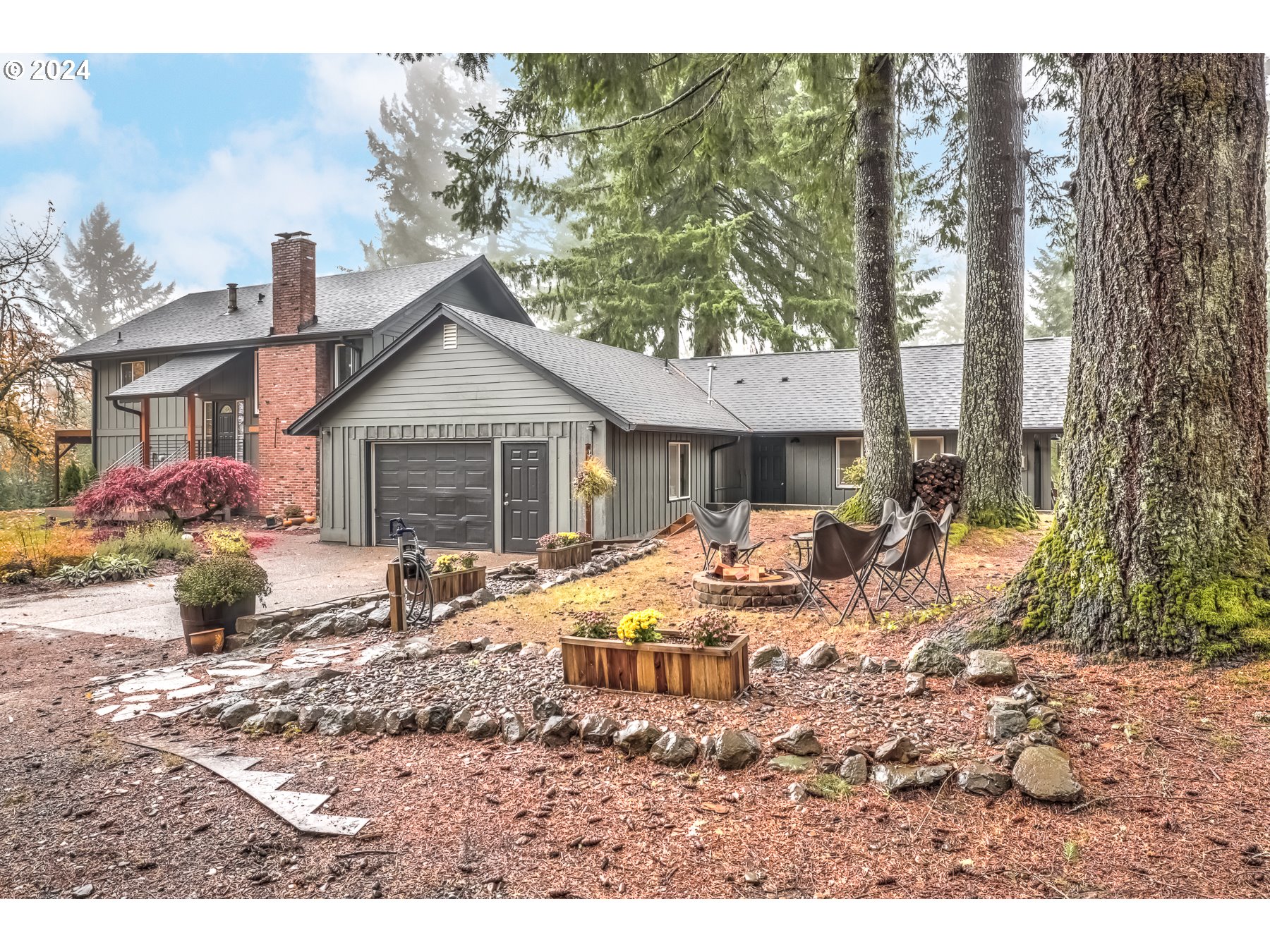 a front view of house with yard outdoor seating and barbeque oven