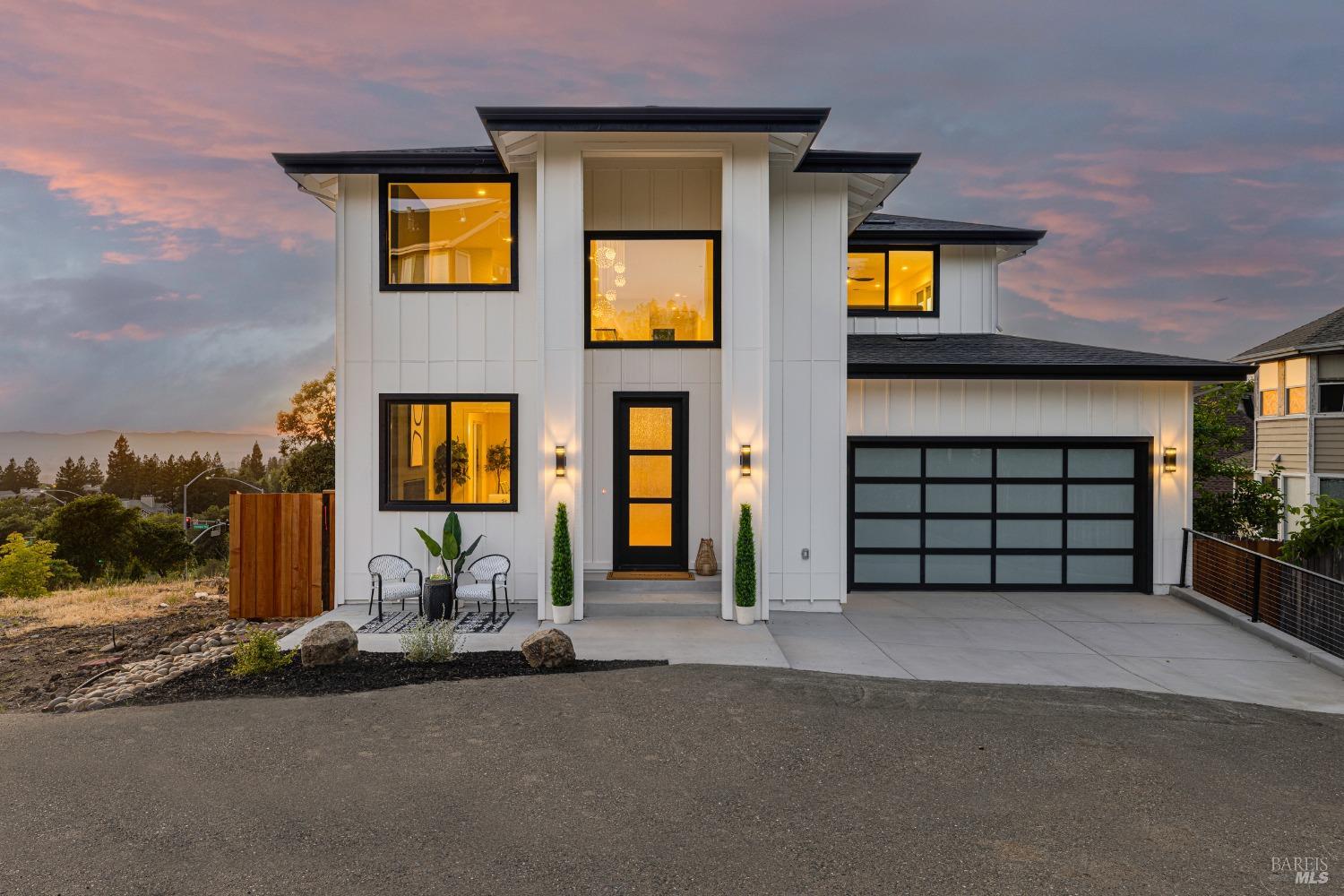 a front view of a house with a garage