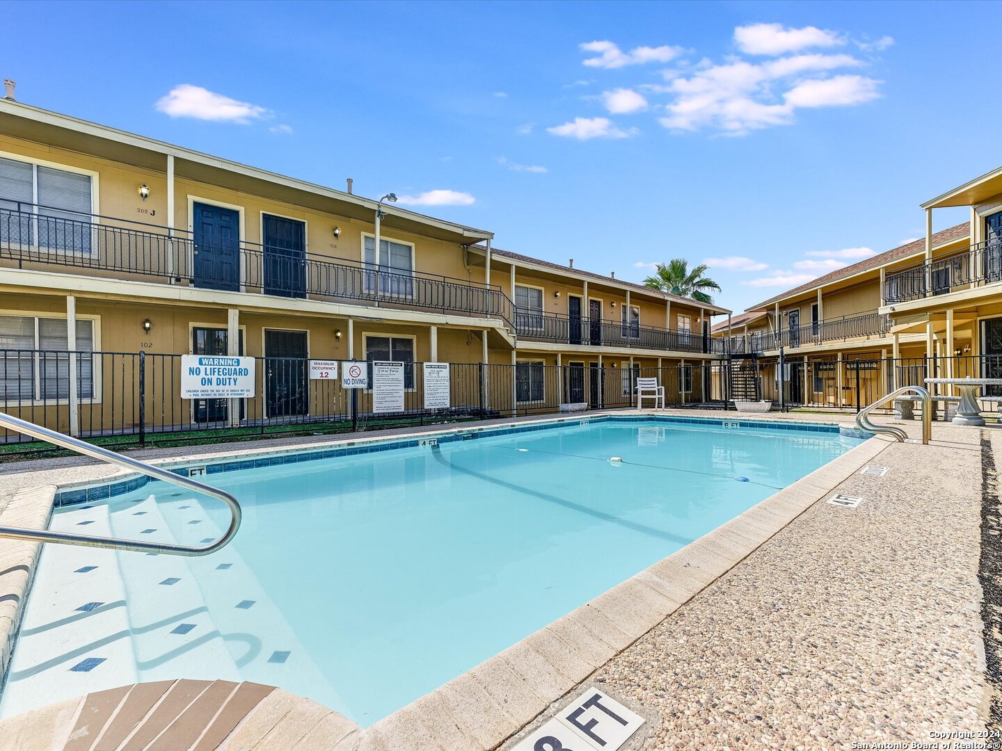 a view of a building with a swimming pool