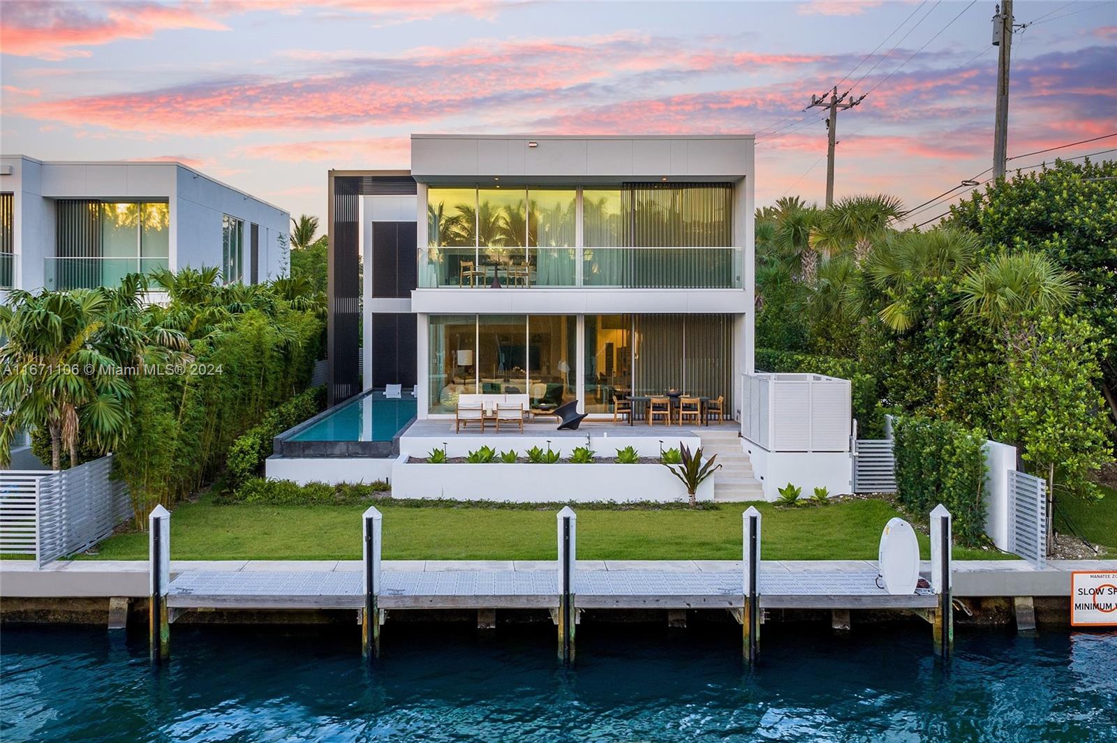 a view of a house with backyard porch and sitting area