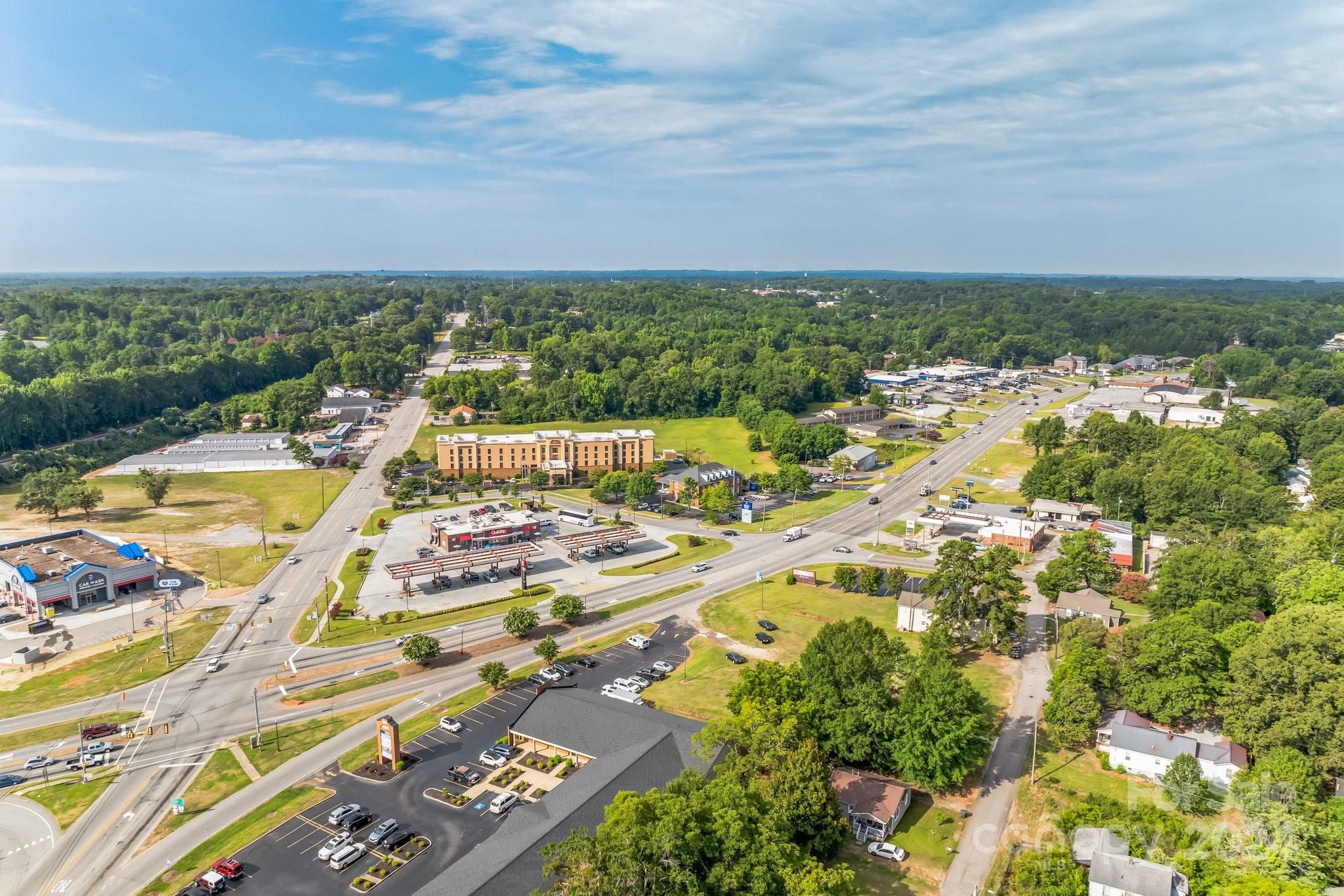 an aerial view of residential building and lake