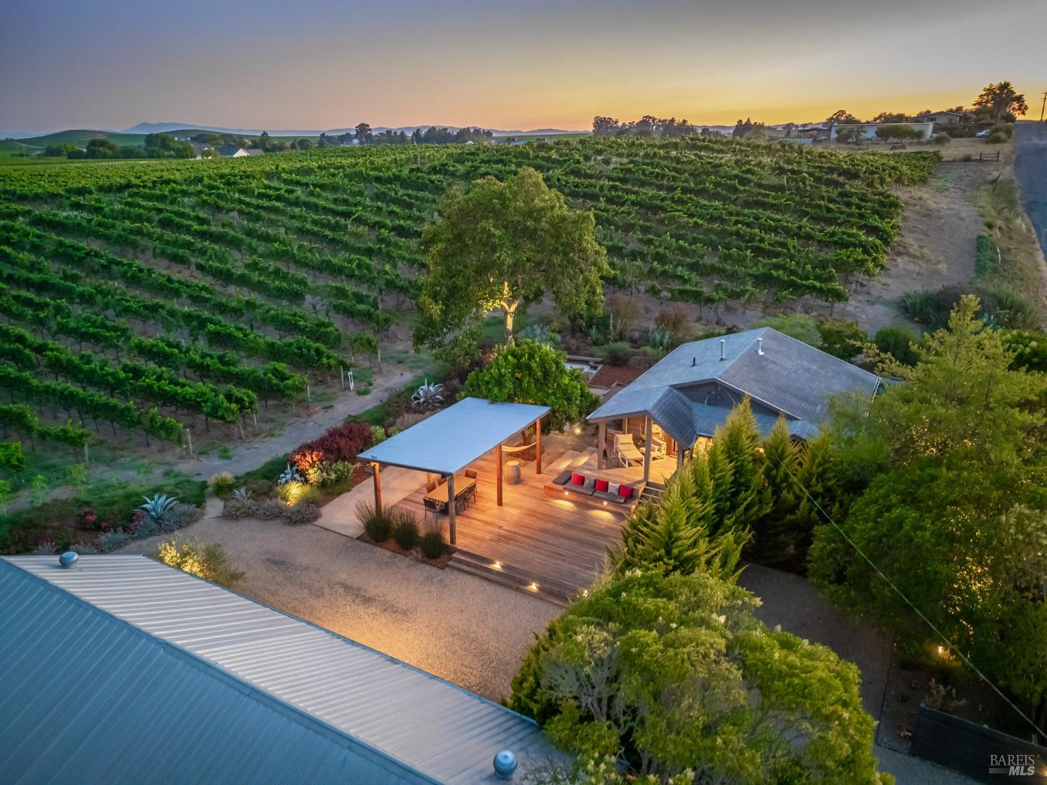 an aerial view of a house with outdoor space