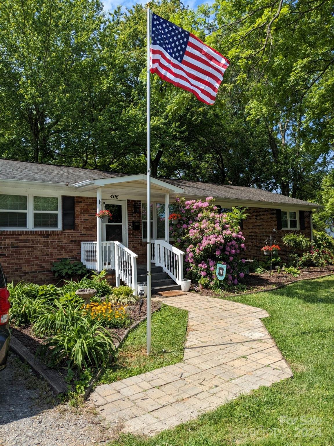 a front view of a house with garden