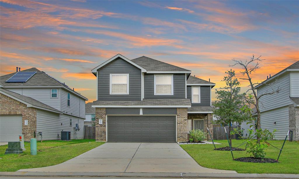 a front view of a house with yard