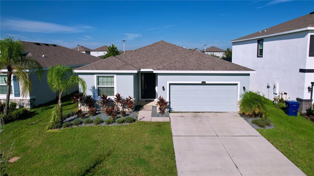 a view of a house with garden and yard