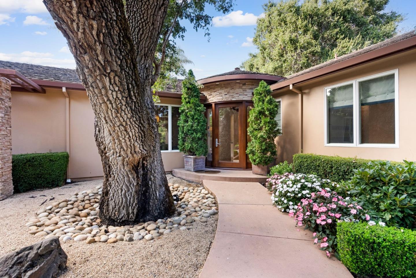 a front view of a house with garden