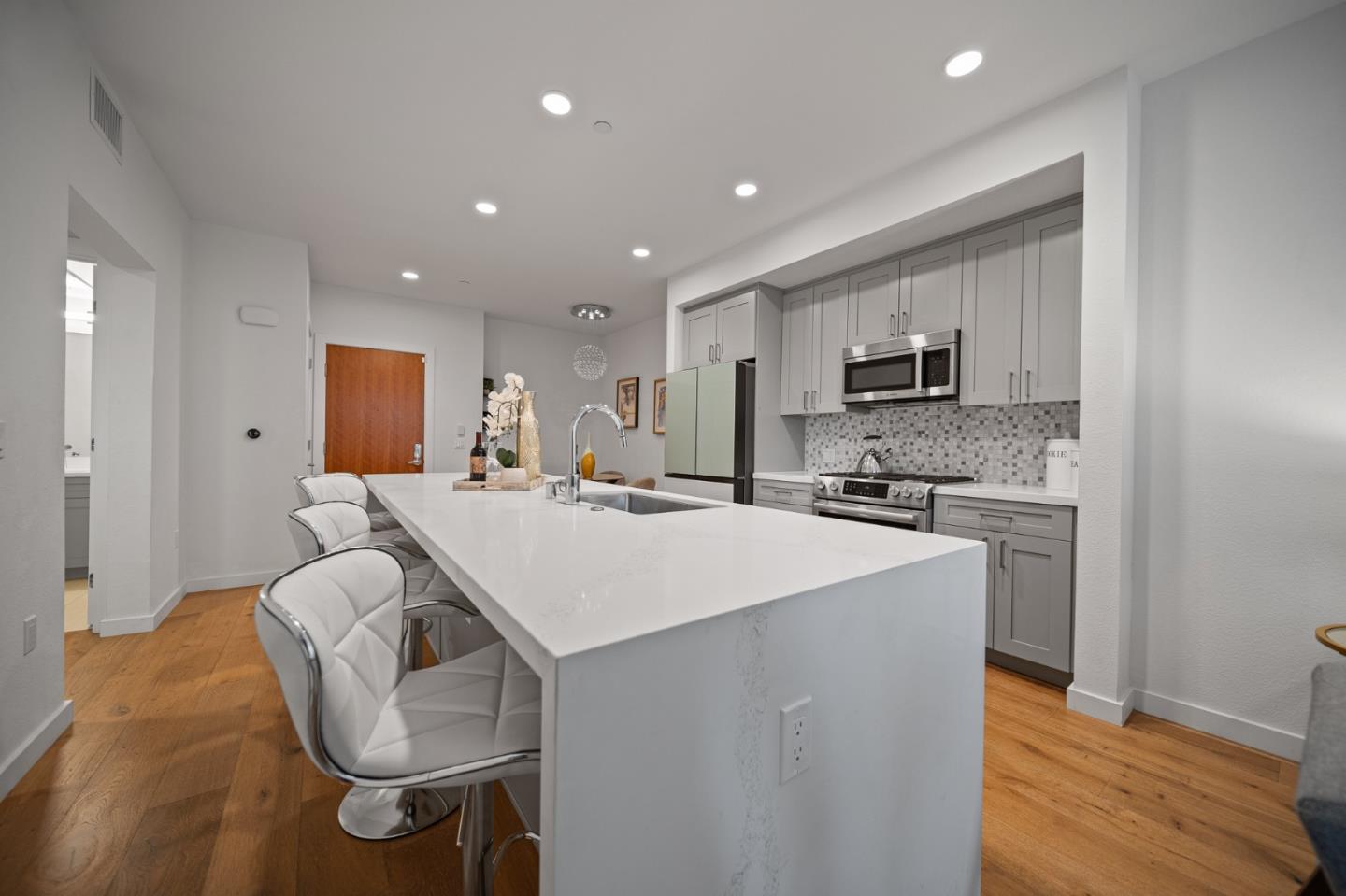 a kitchen with kitchen island a appliances counter space and a sink