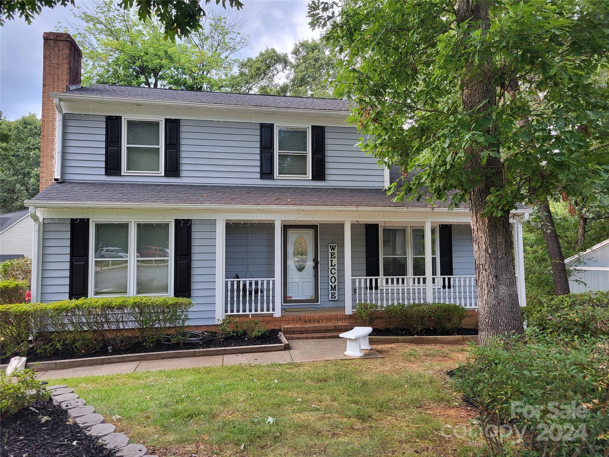 front view of a house with a yard