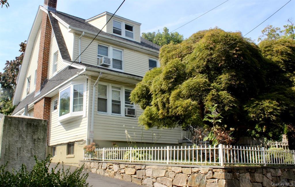 View of home's exterior featuring cooling unit