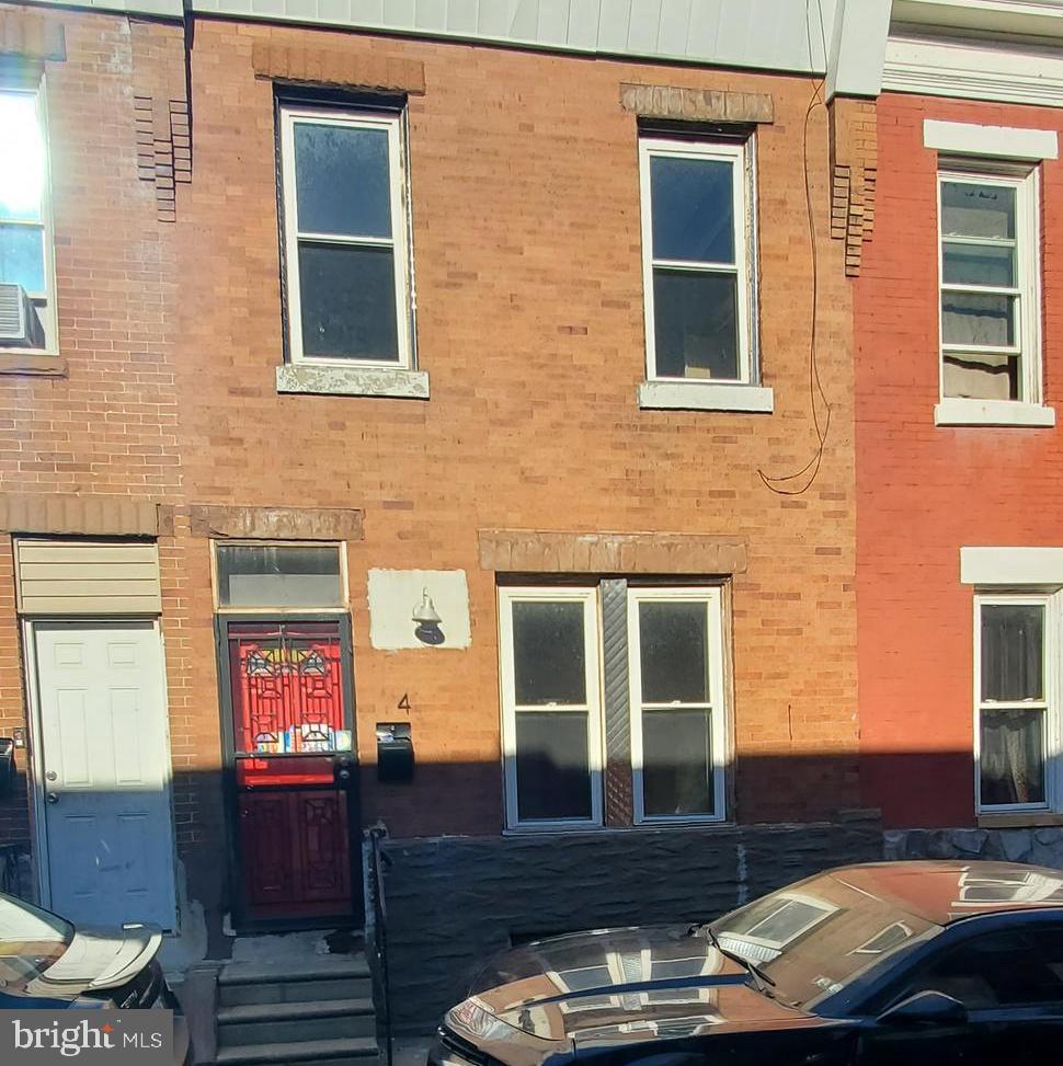 a view of a brick building with many windows