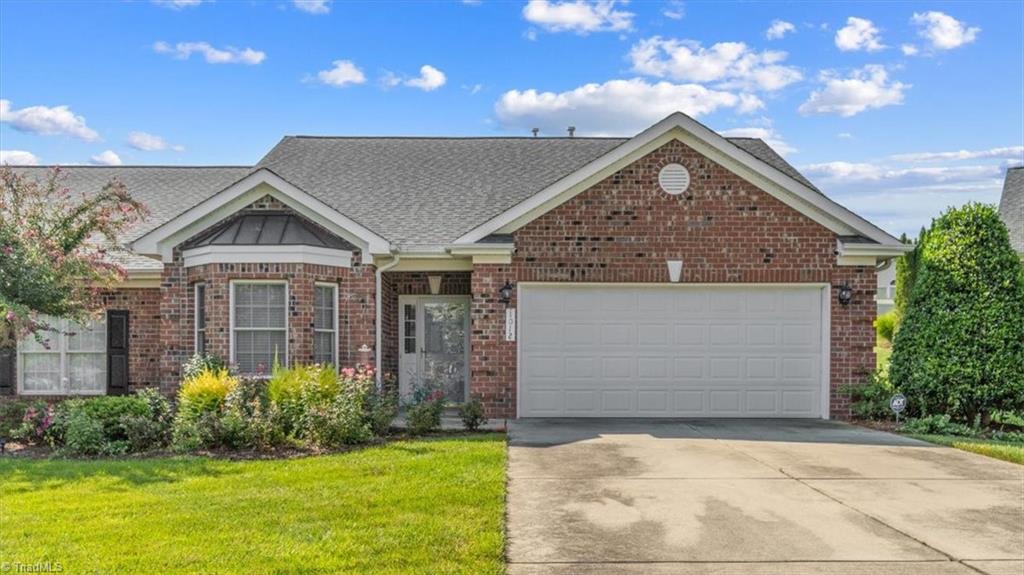 Beautifully landscaped yard with a view of the pond across the street