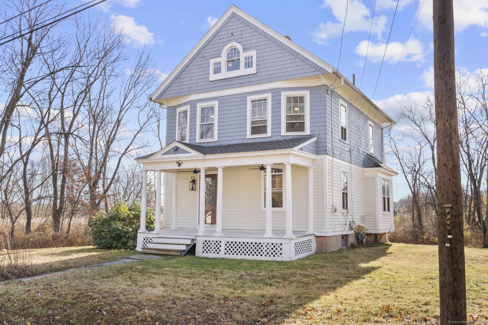 a view of a house with a yard