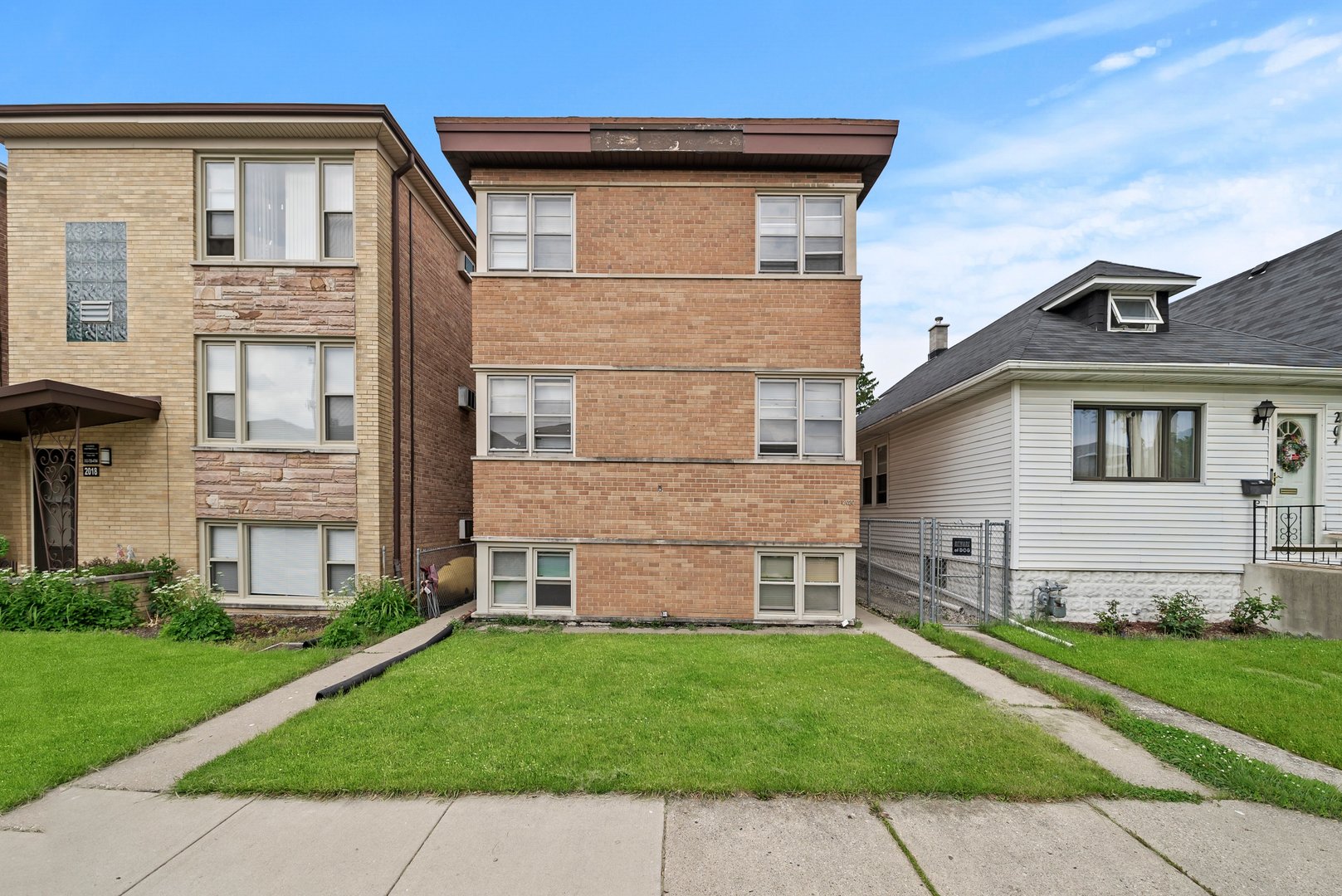 front view of a house with a yard