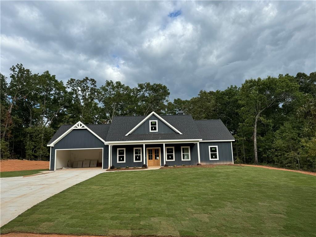 a front view of a house with garden