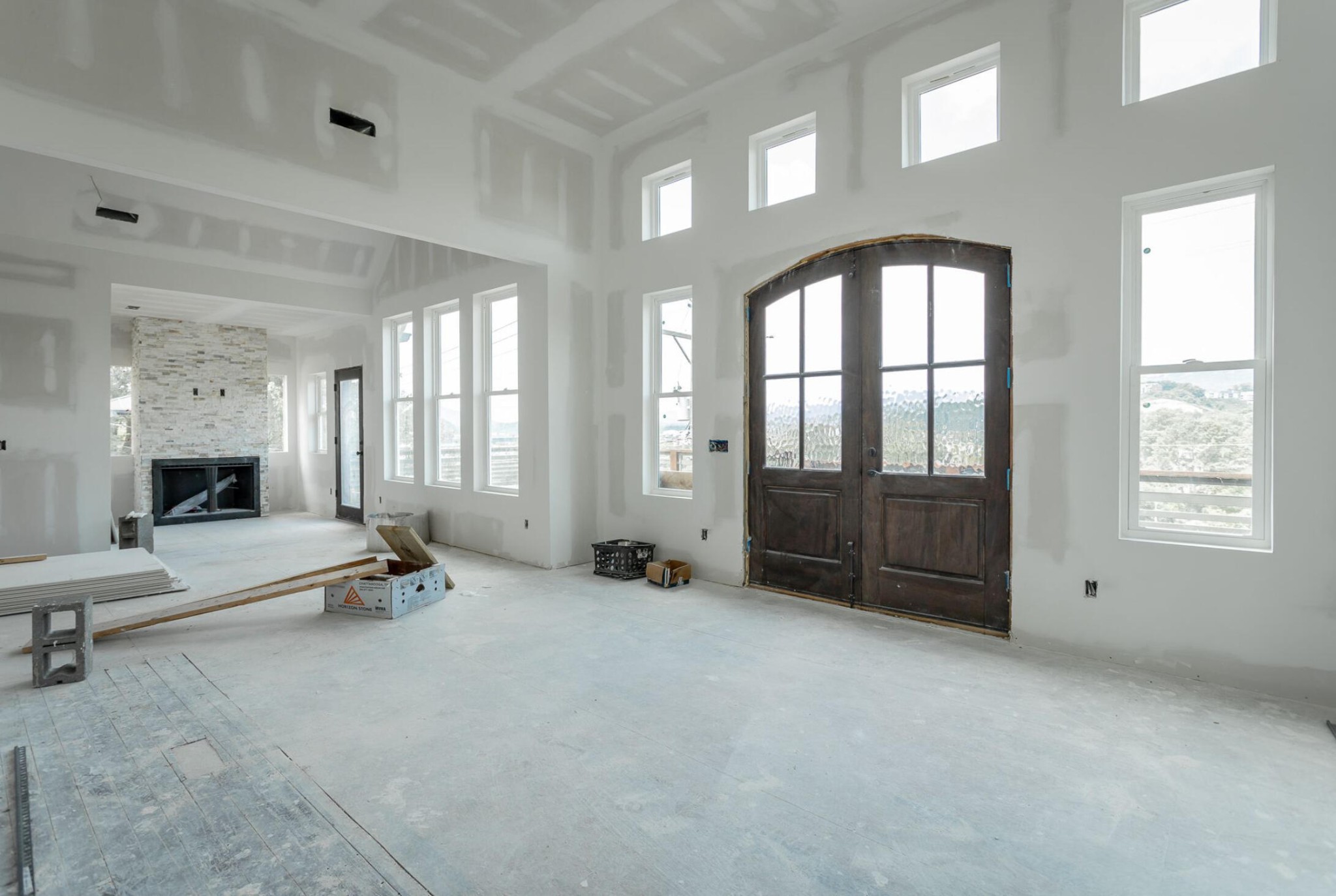 wooden floor with windows in room