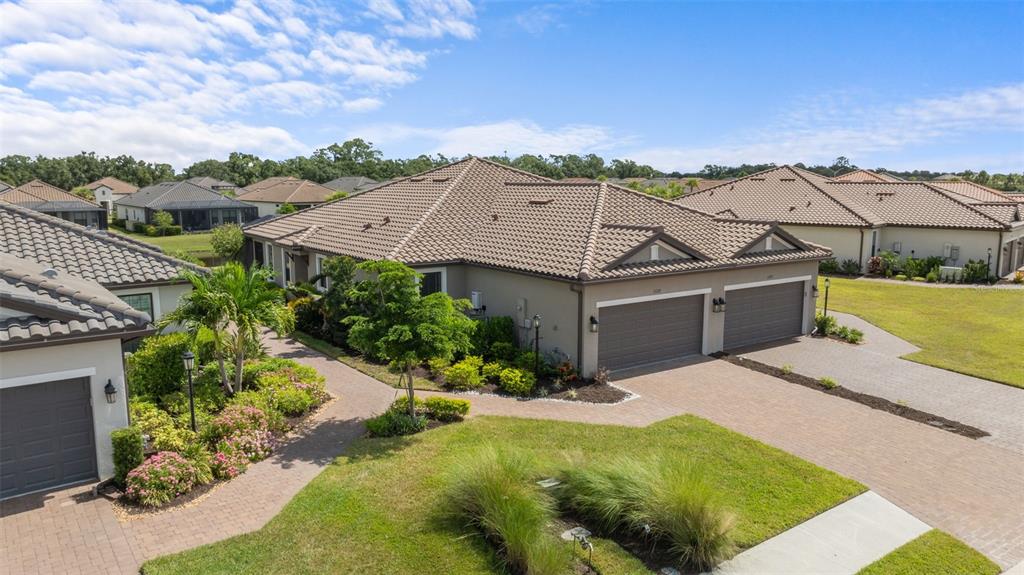 an aerial view of houses with yard