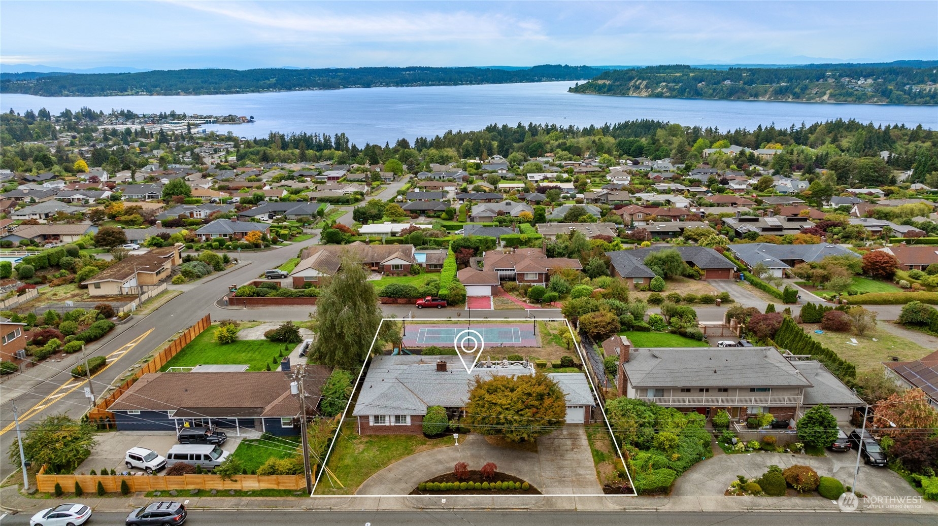 an aerial view of residential houses with outdoor space