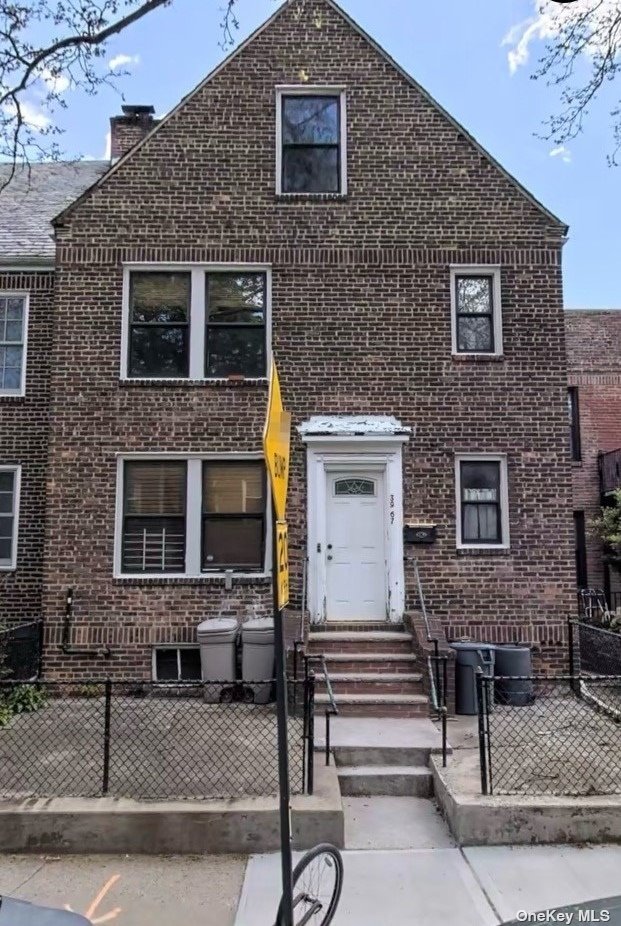 a front view of a house with stairs