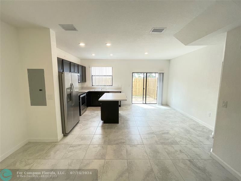 a view of a kitchen with a sink