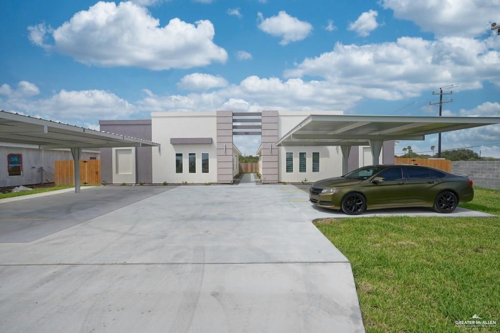 View of front of house featuring a carport