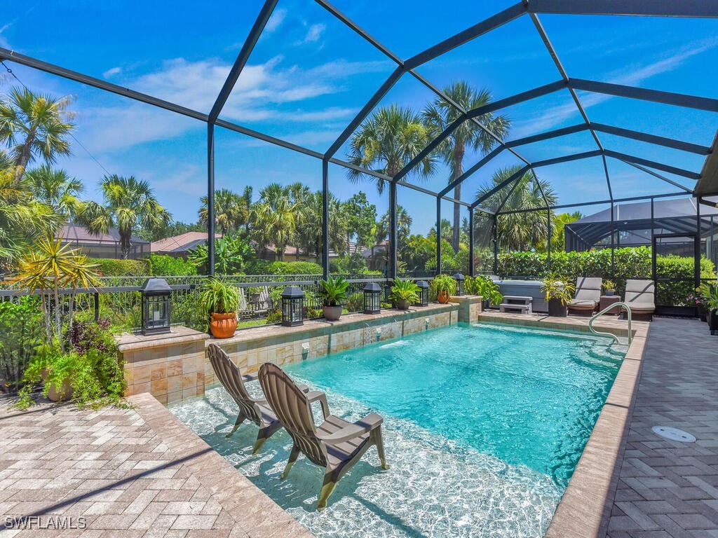 a view of a backyard with sitting area