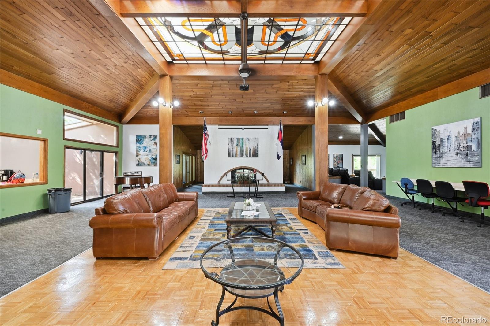 a living room with furniture a couch and a chandelier