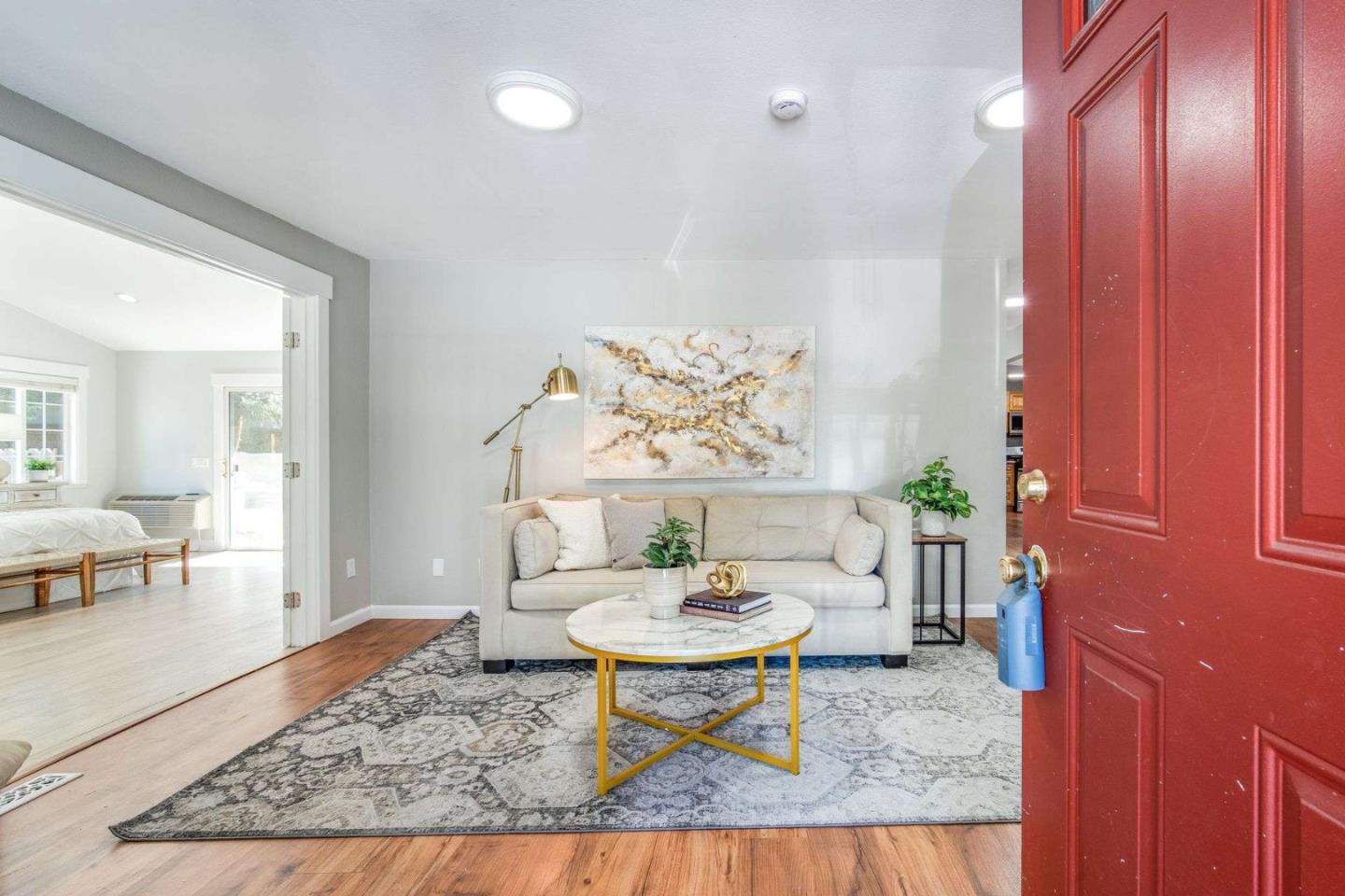 a living room with furniture and a table