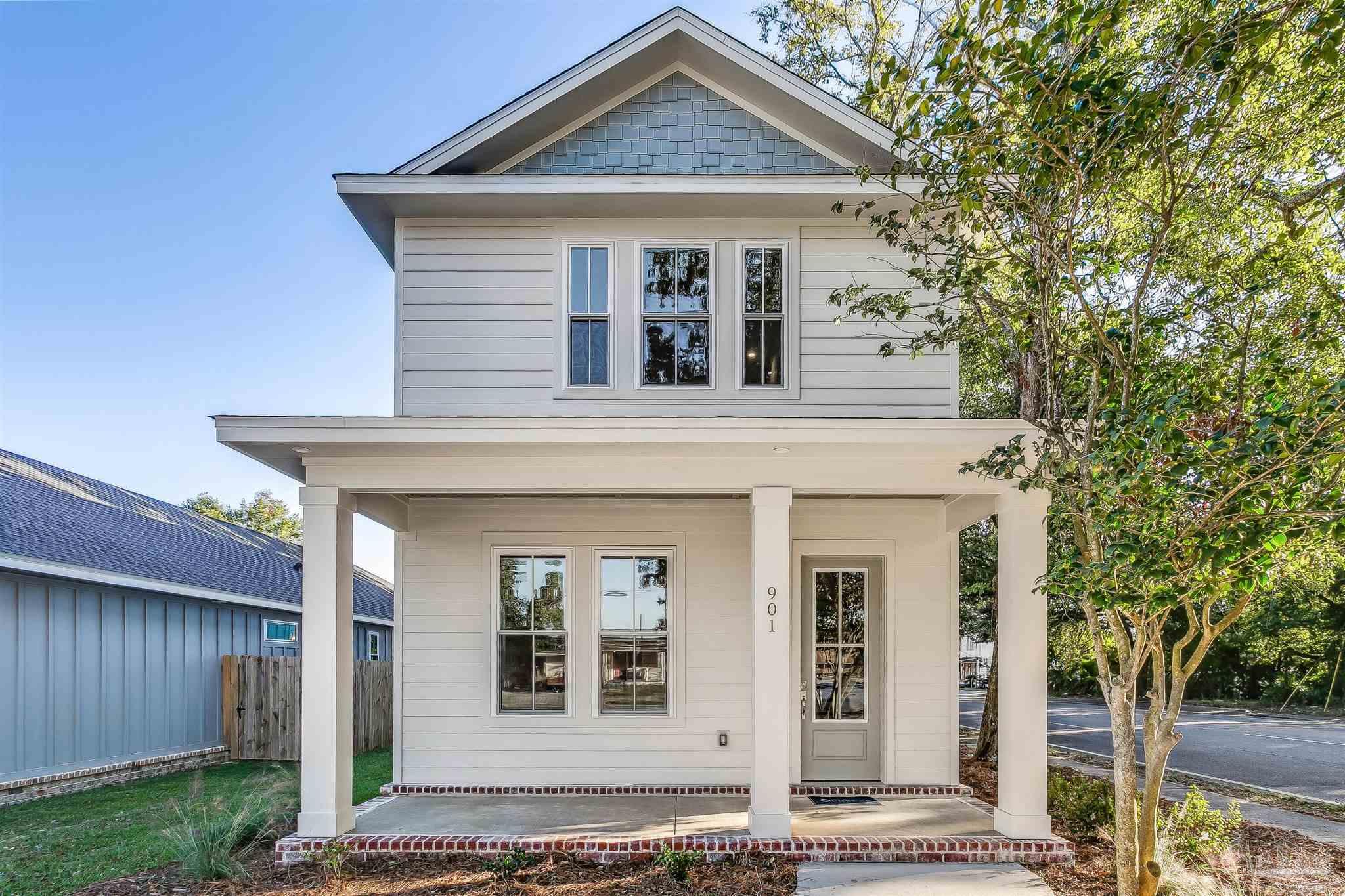 front view of a house with a small yard