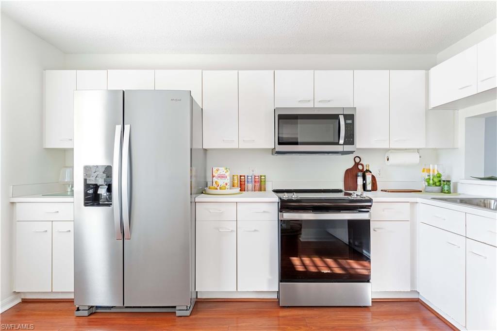 New stainless appliance package, single basin sink, and modern faucet