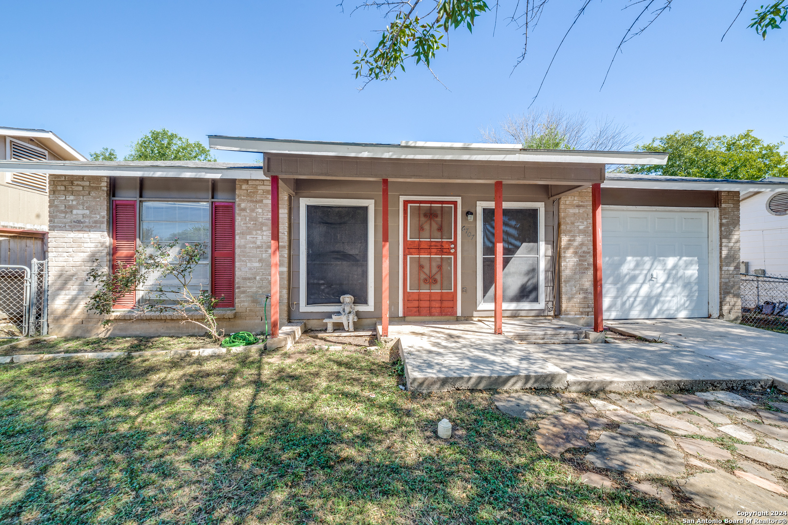 front view of a house with a yard