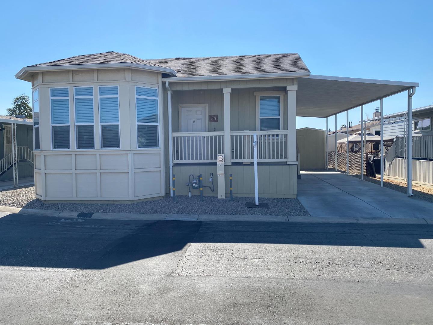 a front view of a house with wooden fence