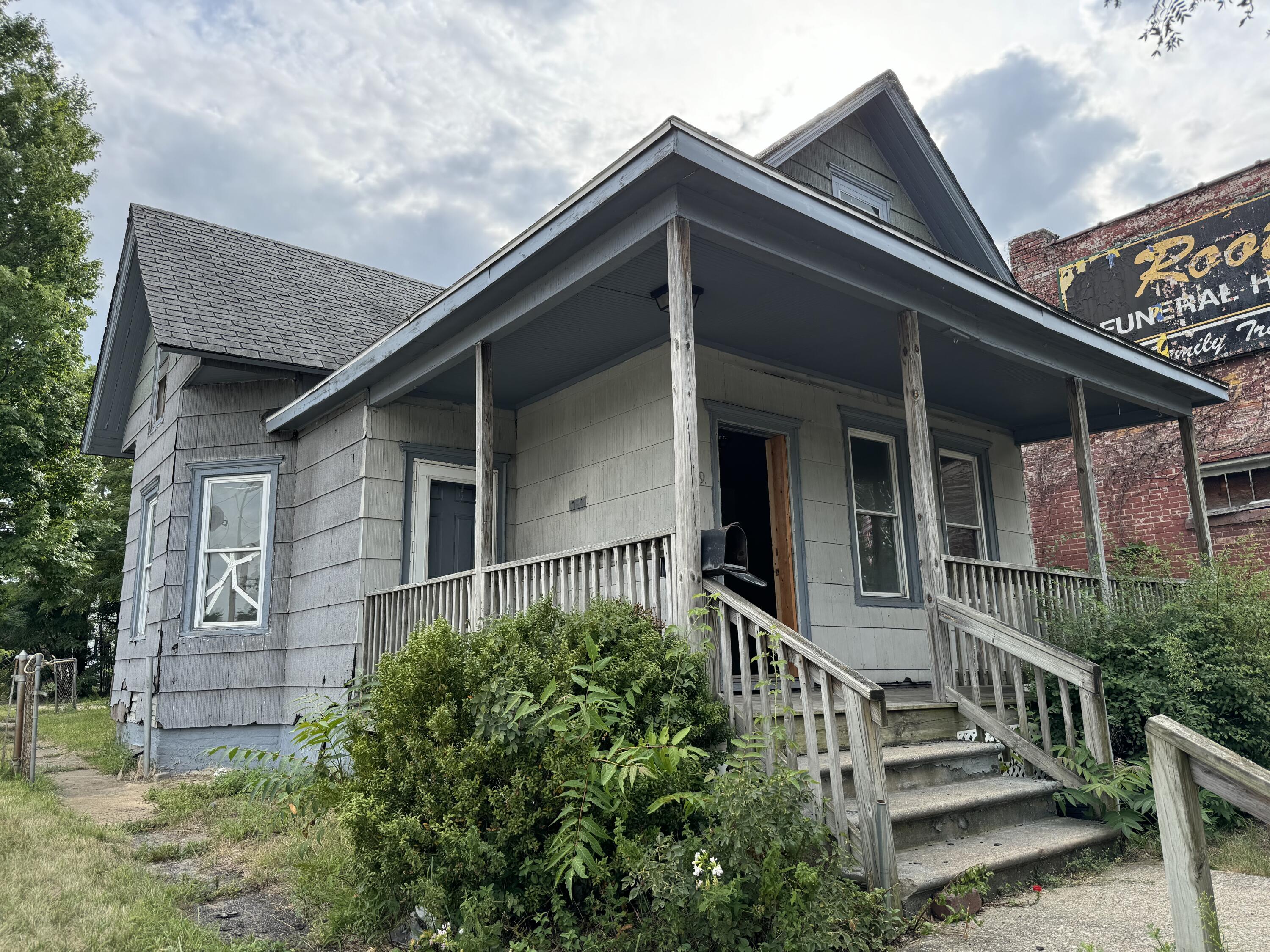 a front view of a house with stairs