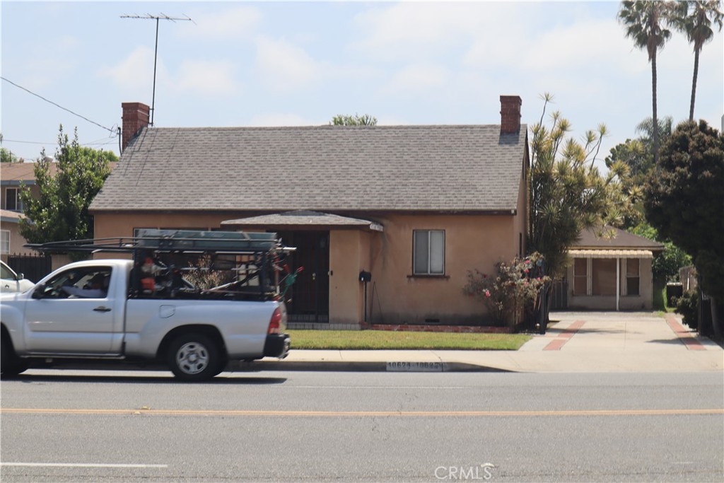 a view of a car parked in front of a house