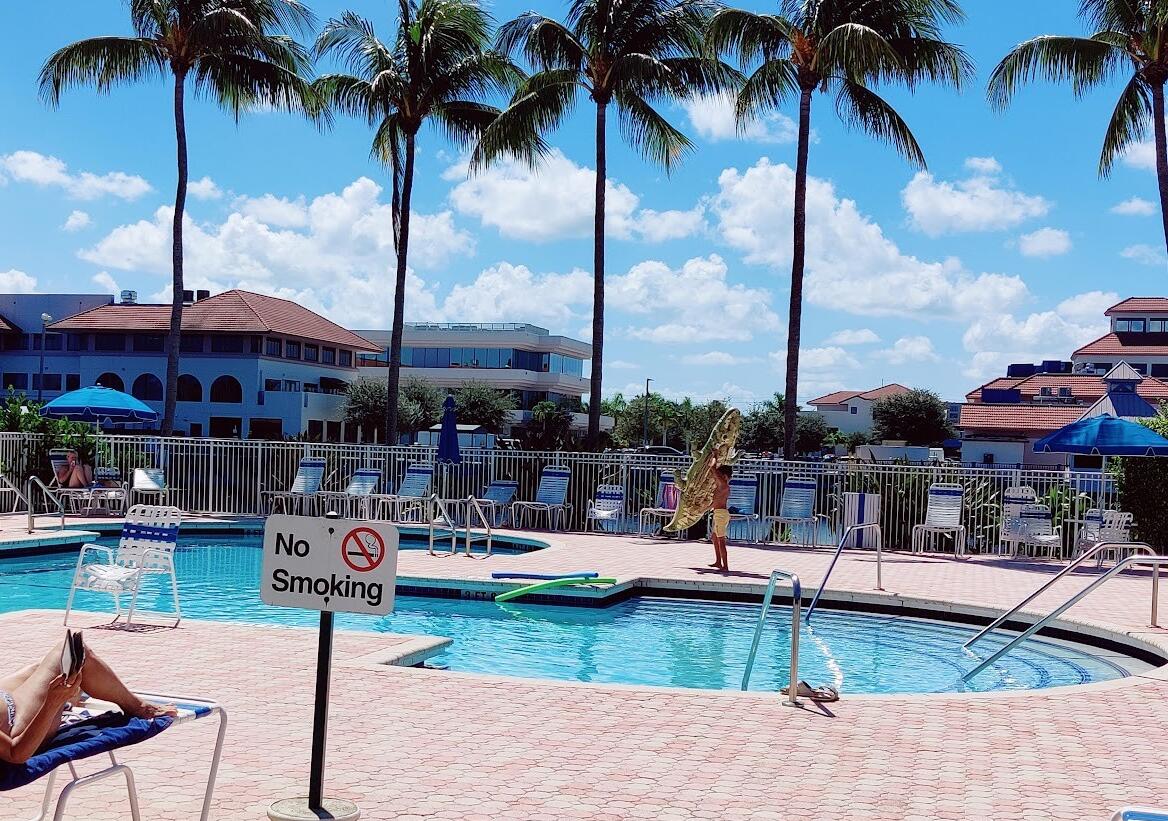 a swimming pool with outdoor seating