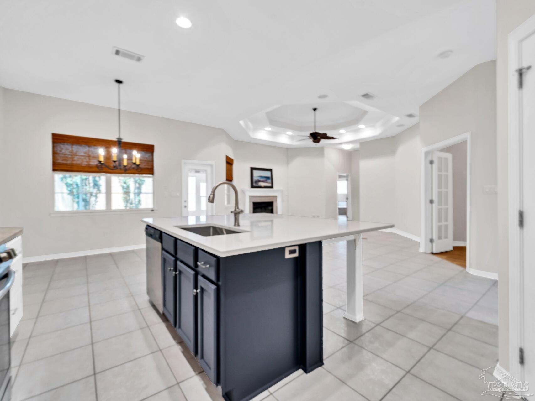 a kitchen with a counter space dining table and a window