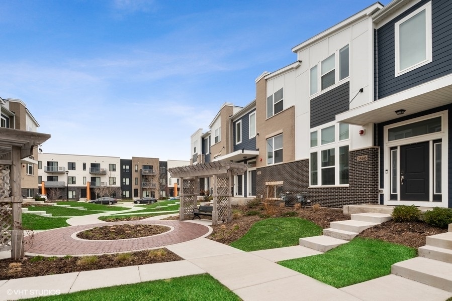 a view of a building with a yard