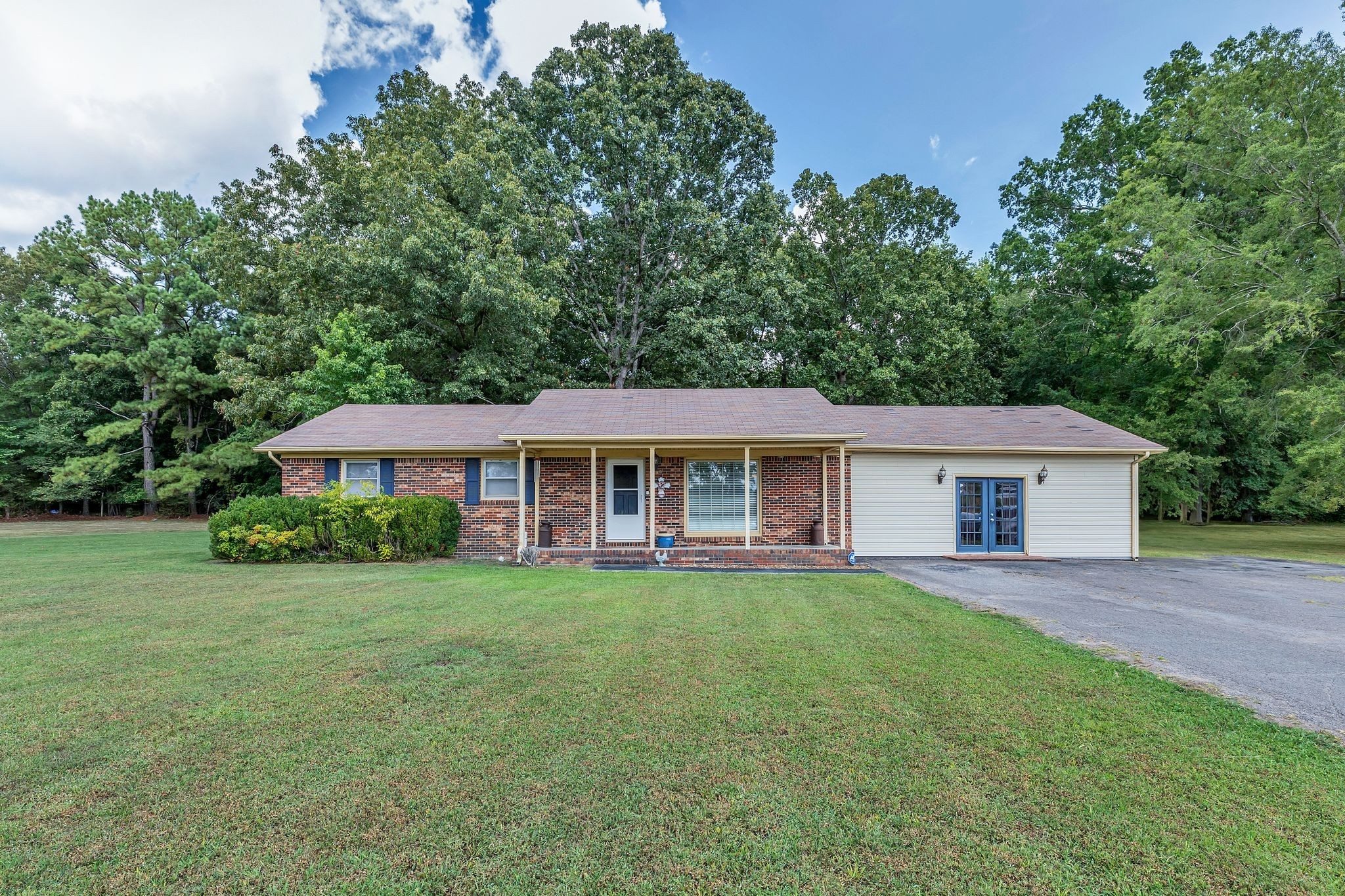 a view of a house with a yard