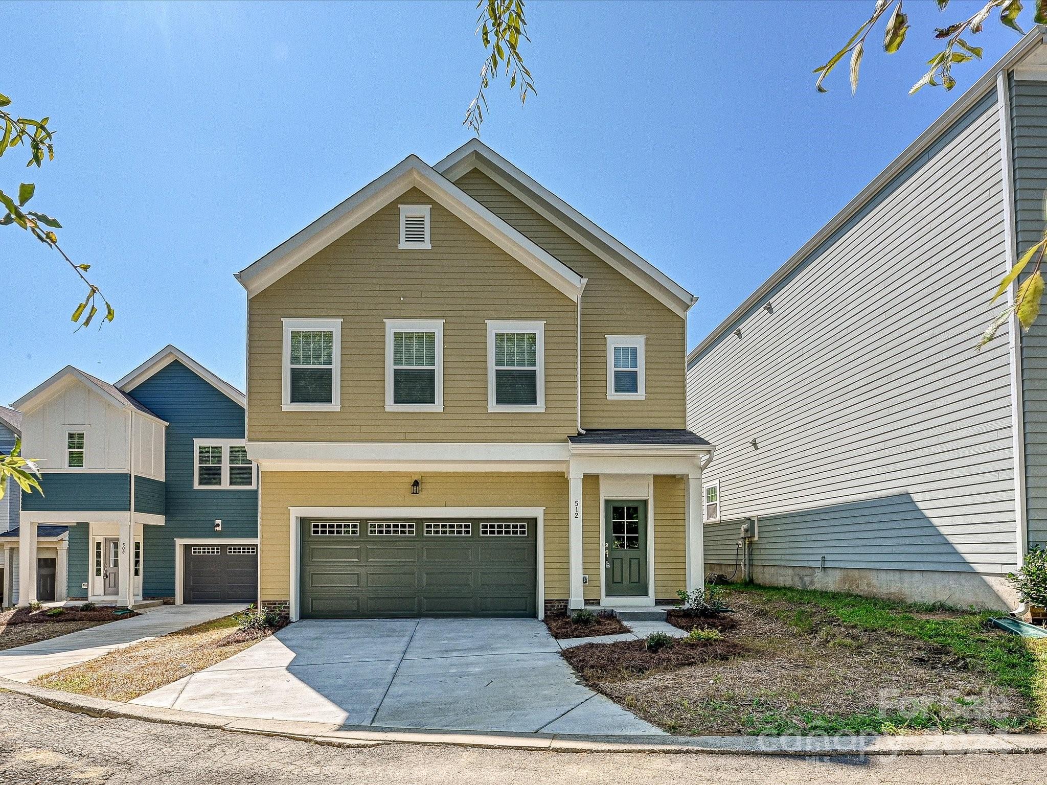 a front view of a house with yard